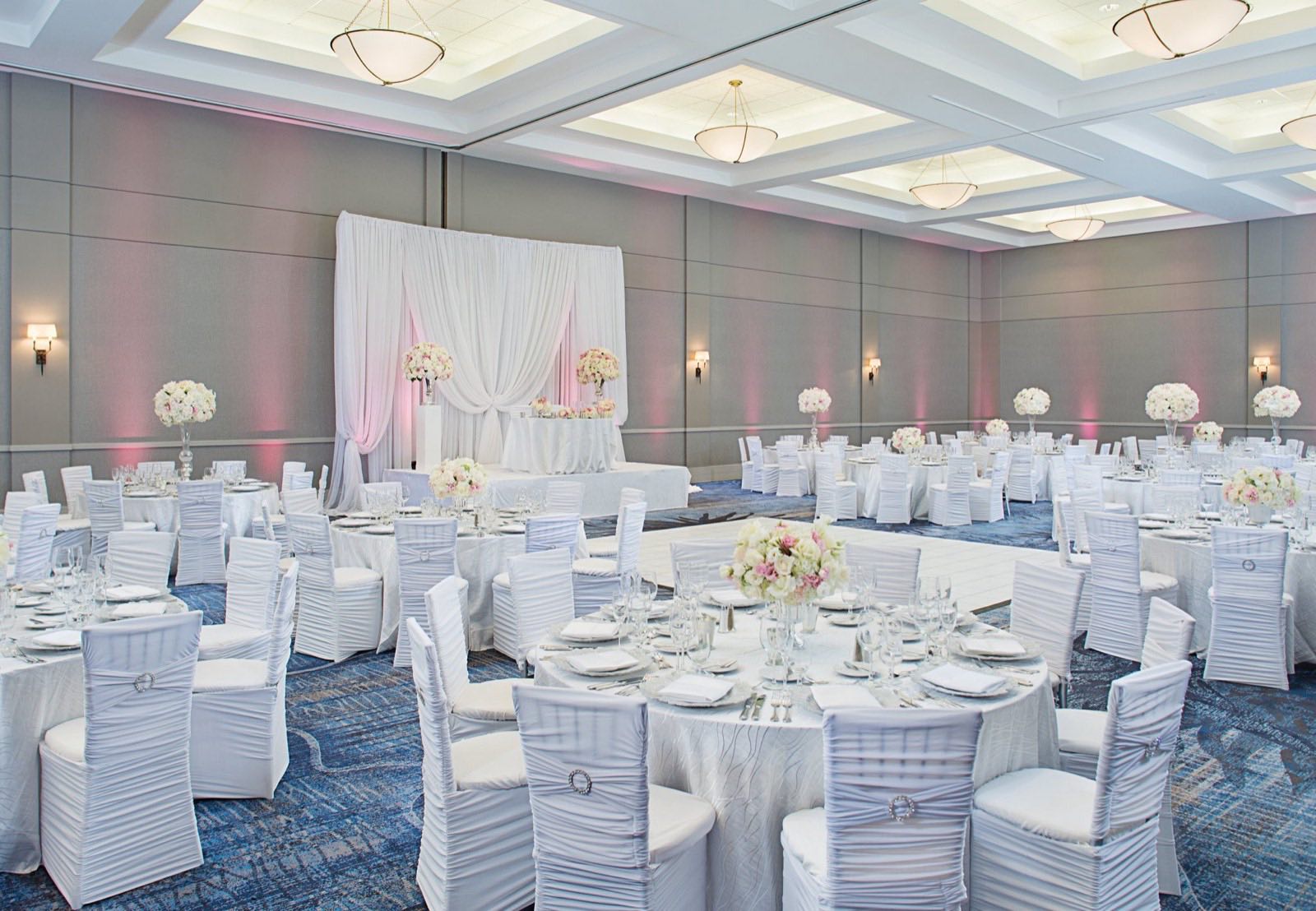 Academy Ballroom dressed for a banquet with round tables and white linens