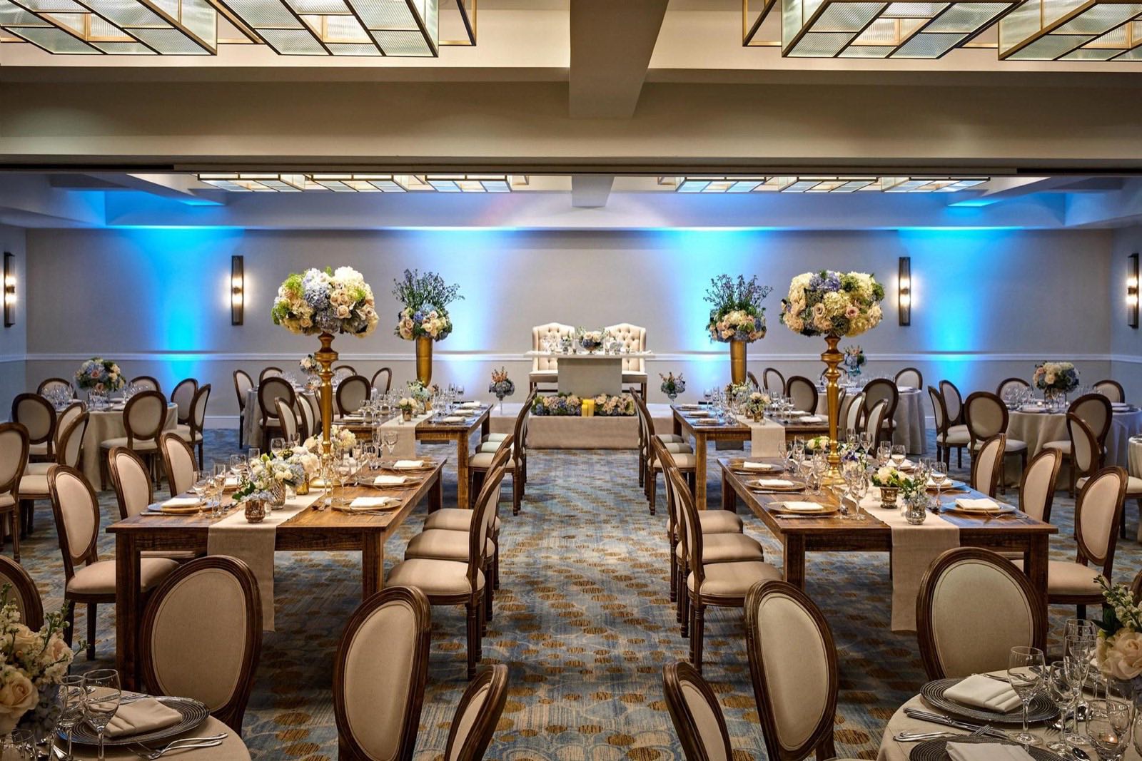 City Ballroom dressed for a wedding reception with blue uplighting